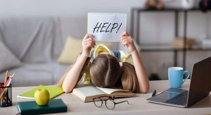 Young girl having trouble reading