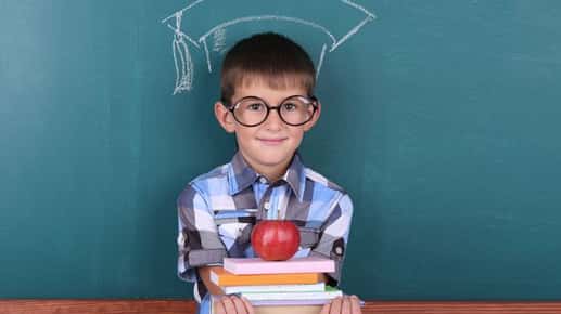 boy with glasses in classroom